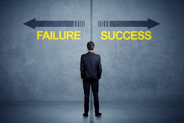 Man looking at wall that says failure or success. Accurate Cannabis data will help you reach success.